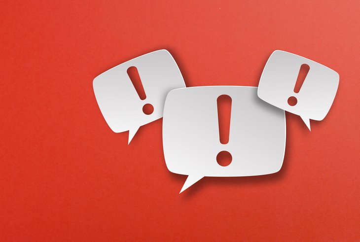 Exclamation mark with speech bubbles on red background