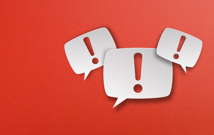 Exclamation mark with speech bubbles on red background