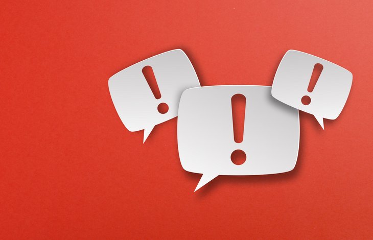Exclamation mark with speech bubbles on red background